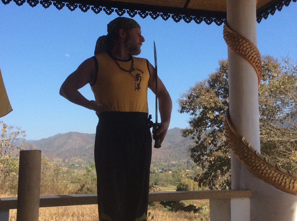 the other is doing the broadsword salute with Moon behind.